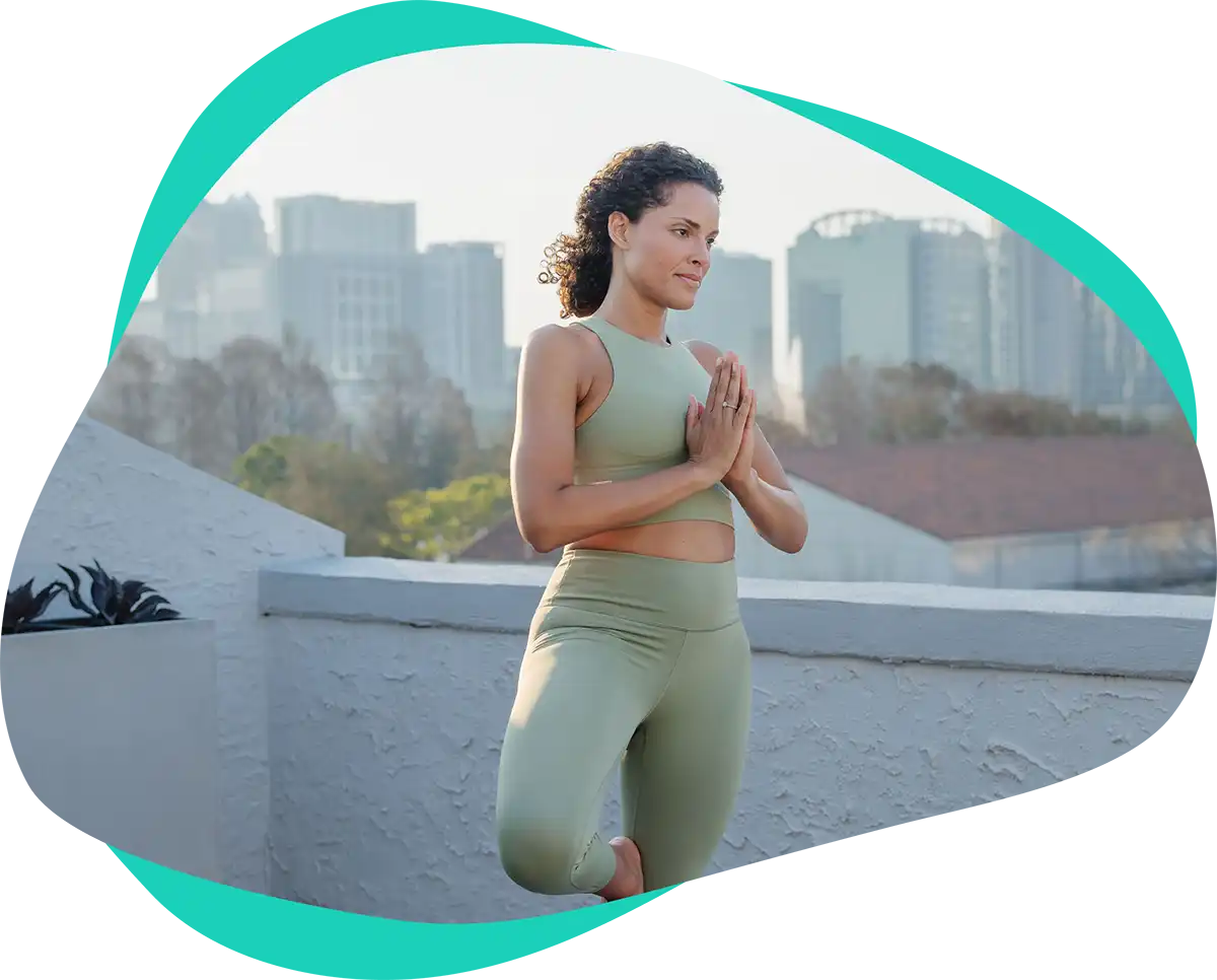Woman doing yoga outside on a terrace